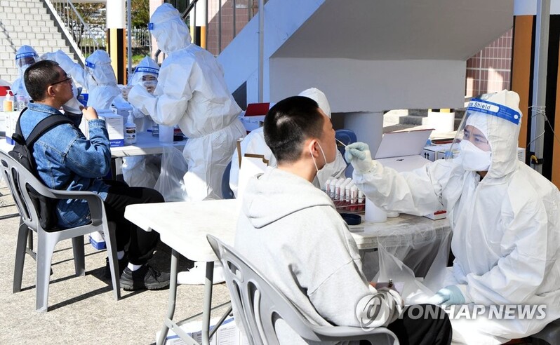 (LEAD) New virus cases in 400s for 2nd day, upticks worrisome amid spring break