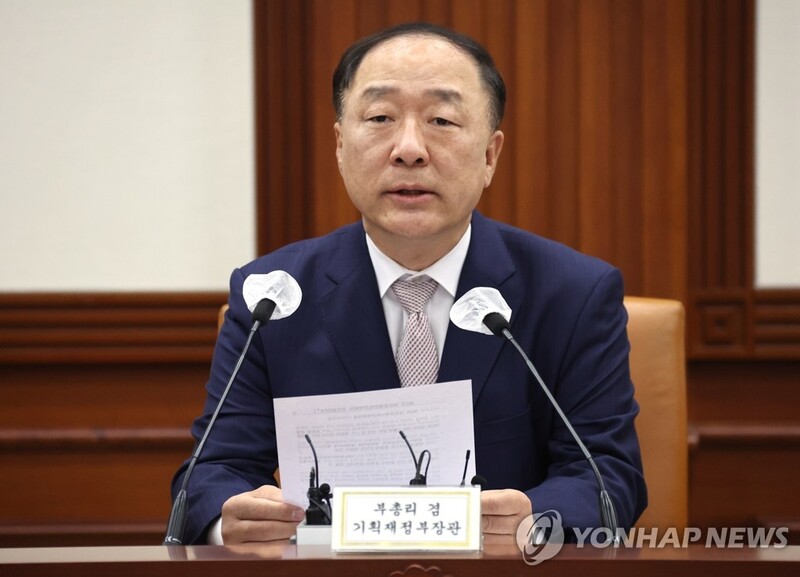 Finance minister sees slower-than-expected economic growth, higher inflation this year