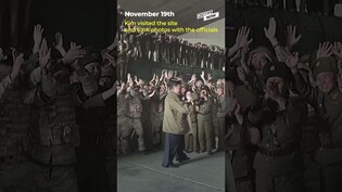 N.Korean soldiers fall over while taking photos with Kim