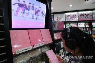 Half of K-pop fans buy album to collect goods