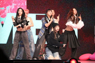 Performance photo of NMIXX during media showcase of first mini album ‘EXPERGO’