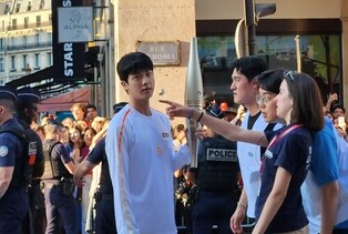 BTS Jin Carries Olympic Torch in Paris Amid Cheers from Thousands of 'ARMY' Fans
