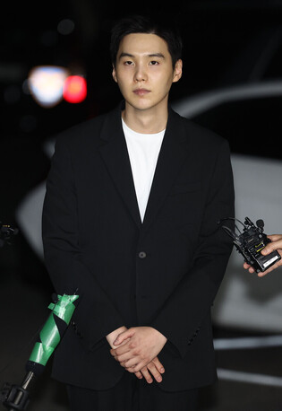 Photos of BTS's Suga at the Police Station