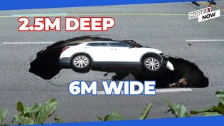 2.5-meter deep sinkhole swallows up a car in the middle of busy road