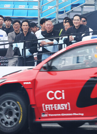 Conglomerate chiefs at racing event
