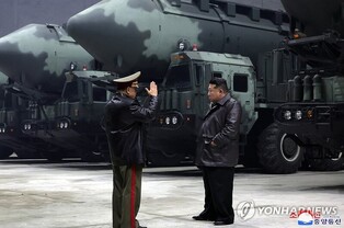 (LEAD) N.K. leader says ICBM launch demonstrates 'counteraction will' against rivals