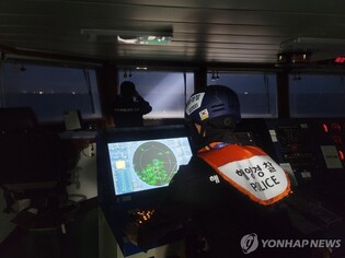 Authorities continue nighttime search for 12 missing from fishing boat