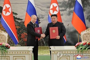 (2nd LD) N. Korea's Kim finalizes defense pact with Russia