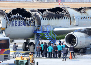Fire-damaged airplane at Gimhae Int'l Airport