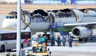 Fire-damaged airplane at Gimhae Int'l Airport