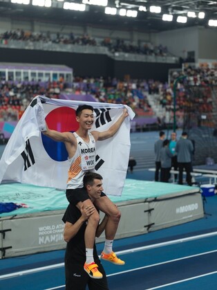 High jumper Woo wins world indoor athletics championships event