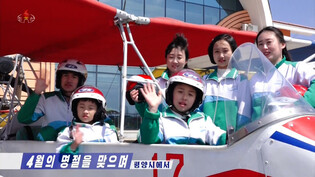 N. Korean youths ride ultralight aircraft