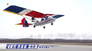 N. Korean youths ride ultralight aircraft