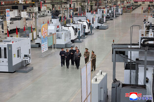 N. Korea's Kim inspects munitions companies