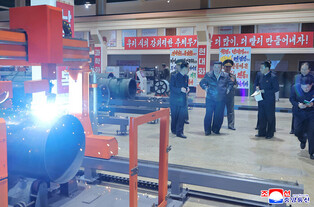 N. Korea's Kim inspects munitions companies