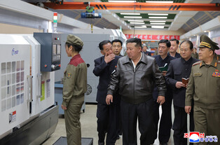 N. Korea's Kim inspects munitions companies