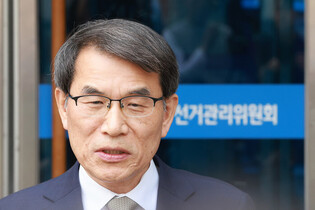 Election watchdog head speaks to reporters