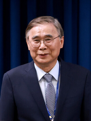 Ex-unification minister nominated as spy chief