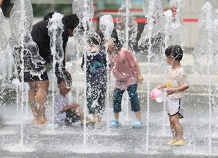 Playing in fountain on hot day