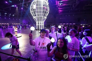 Fans flock to BTS Festa amid growing hopes for full-group comeback