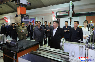N. Korean leader inspects munitions plant