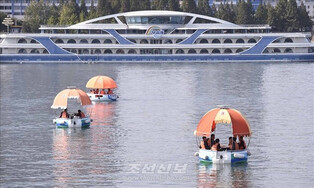 Cooling down on river in Pyongyang