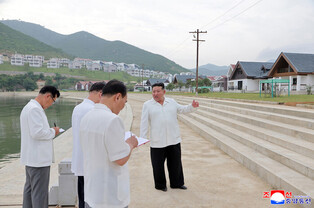 N.K. leader inspects offshore farm under construction