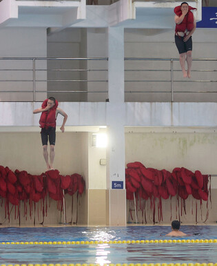Sailors take part in combat swimming drill