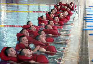 Sailors take part in combat swimming drill