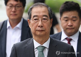 Ex-PM Han booked for alleged perjury over martial law attempt