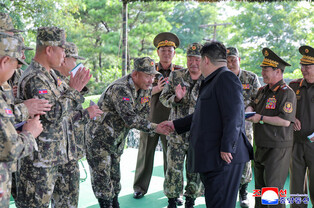 N.K. leader observes firing contest of artillery subunits