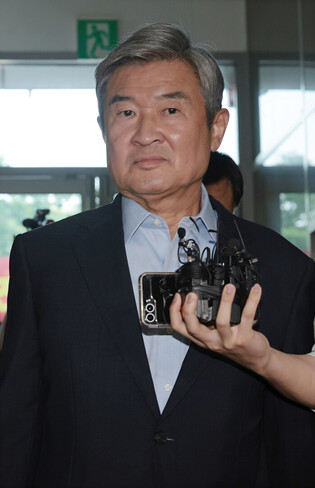 Ex-spy chief grilled over Marine death