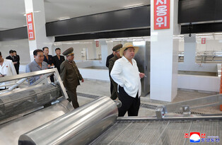 N.K. leader inspects offshore farm, fishing-village district