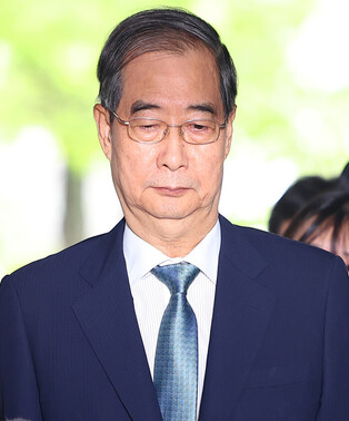Court to decide on arrest warrant for ex-PM Han