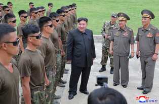 N.K. leader inspects sniper, special forces units at training base