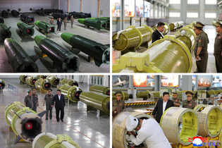 N.K. leader inspects new missile-producing factory