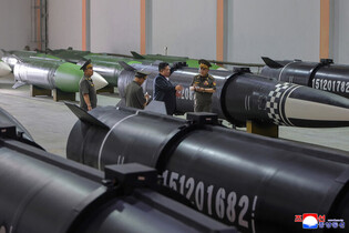 N.K. leader inspects new missile-producing factory