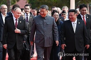 (ROUNDUP) Kim joins Putin, Xi at military parade, in display of defiance against West