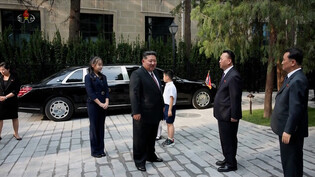 Kim Jong-un visits N. Korea's embassy in China with daughter
