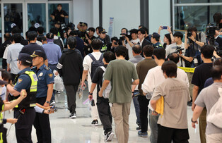 S. Korean workers return home after immigration detention in U.S.