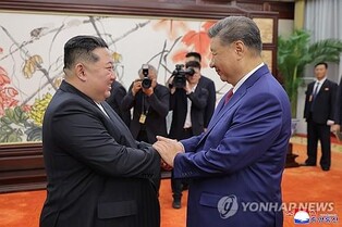 Kim tells China's Xi that Pyongyang will further bolster ties with Beijing