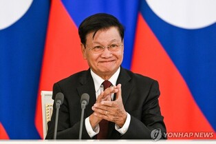 (LEAD) Laos' leader to visit N. Korea to mark key party anniv.: KCNA