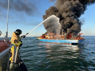 Shipping boat on fire