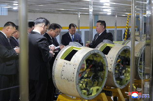 N.K. leader calls for expanding missile, shell production capacity