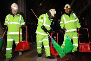 Prime minister sweeps street