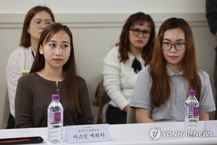 Foreign maids under gov't pilot project overworked, underpaid: poll